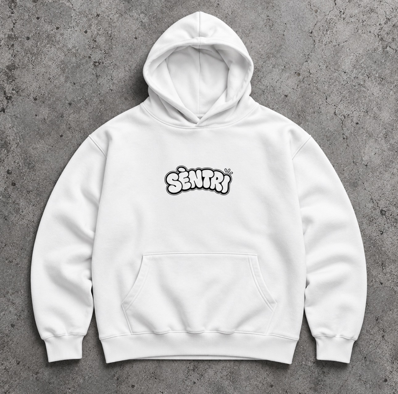 SÈNTRI Bubble Piece white hoodie laid flat on concrete
